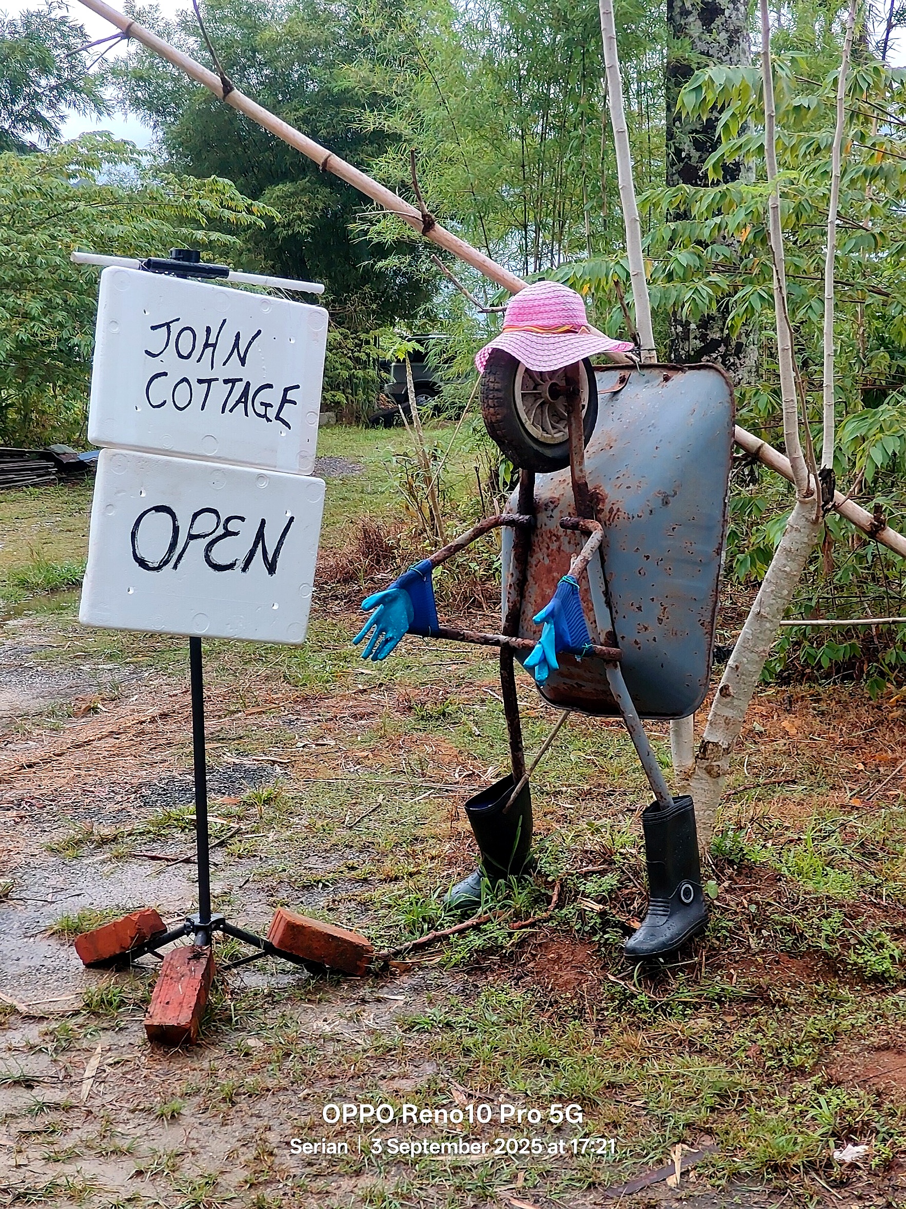 John Cottage open sign and welcome figure