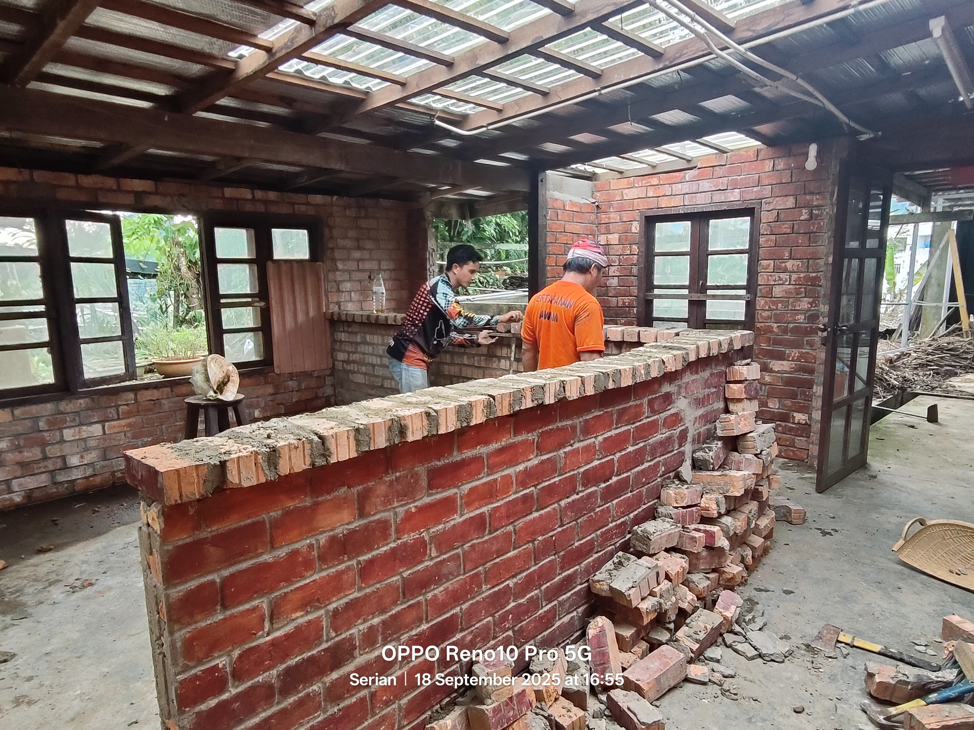 Brick wall construction at John Cottage